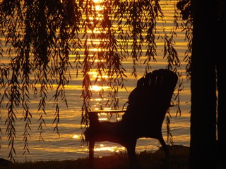adirondack chair at sunset