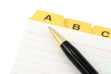 yellow file divider and pen