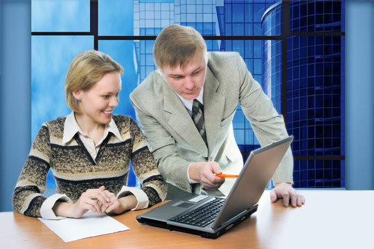 business team man and woman work in office on laptop with view b