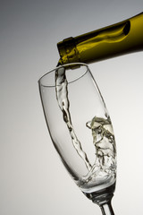 filling glass with white wine