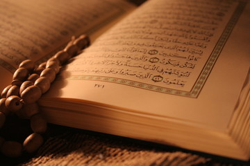 pages of holy koran & rosary