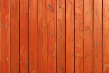 close up of a wooden orange stained fence - obrazy, fototapety, plakaty