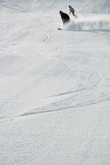two snowboarders carving #2