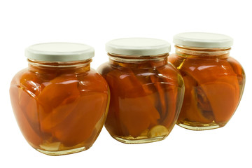 three jars of red peppers marinated