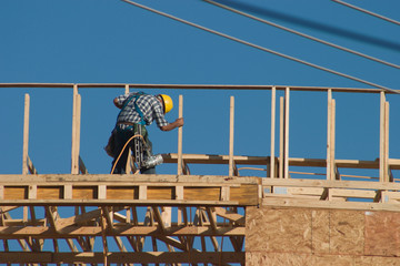 construction worker and nail gun