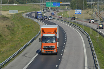 truck driving on busy highway