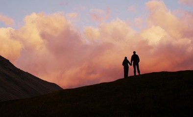 boy and girl on sunset background