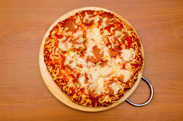 pizza with salami on the table
