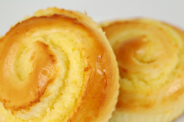 two sweet buns on white plate