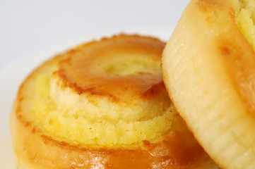 two sweet buns on white plate
