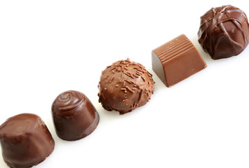 five chocolates isolated on white