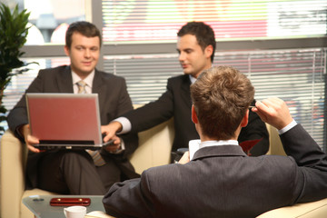 three business men working in the office