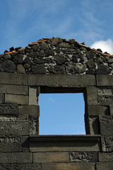 window of a house in ruins in the azores