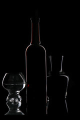 brown bottle and glasses