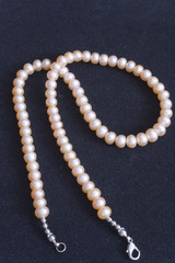 pink pearl's bead on blakck background