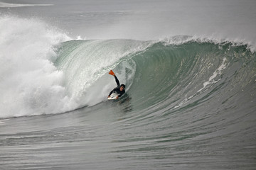 bodyboarder inside the tube