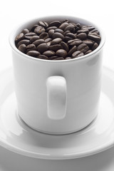 coffee cup full of coffee beans