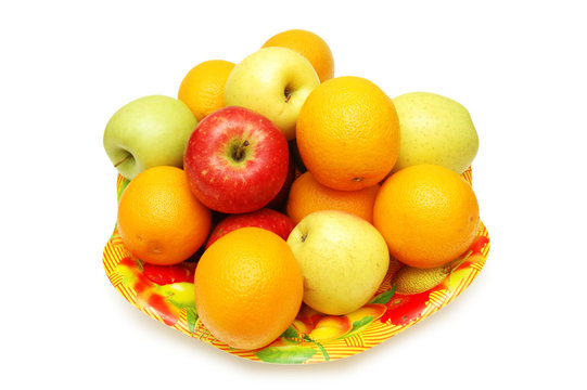 apples and oranges in the tray isolated on white