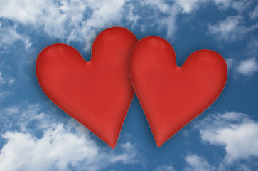Fototapeta na wymiar two hearts on sky