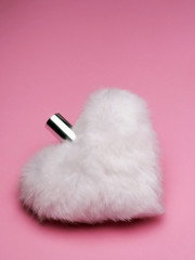 white heart shaped and fur covered parfum bottle o