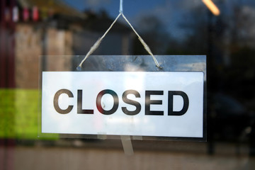 a closed sign in a shop window.