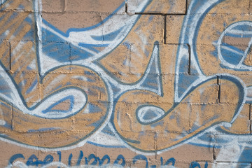 graffiti on cinderblock wall