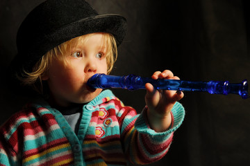 toddler with flute