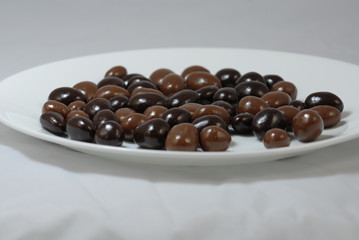 plate with chocolate covered nuts