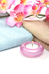 Obraz na płótnie Canvas spa towels, candle and orchid