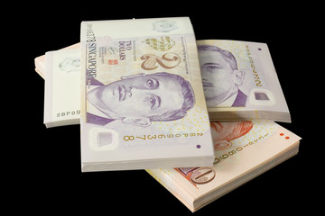 stacks of singapore currency
