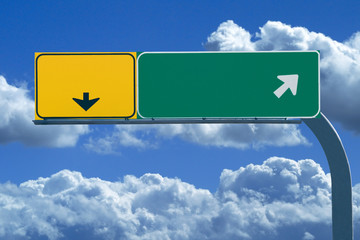 blank freeway sign in blue cloudy skies