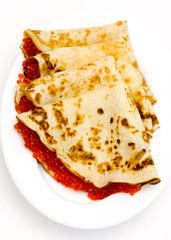 pancakes with red caviar on a plate