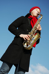 Naklejka premium girl with saxophone