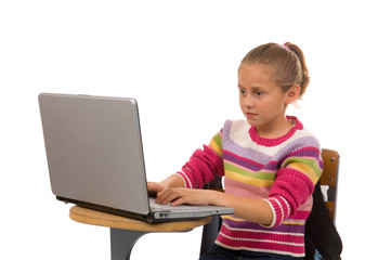 young female student working on laptop computer