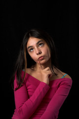 teen posing over black backdrop