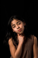 Naklejka premium teen posing over black backdrop
