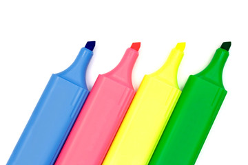 four multicolored markers on white paper