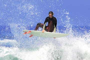 a surfer executing an ariel maneuver