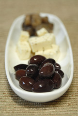 antipasto of black calamata olives, feta cheese an
