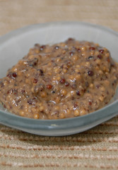 whole grain mustard in condiment glass dish