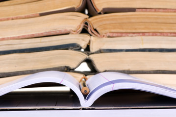 educational concepts (open notebook with books)