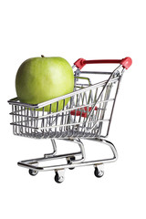 a green apple in a miniature shopping cart