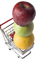 apples and an orange in a miniature shopping cart
