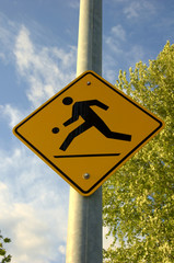 kids playing street sign