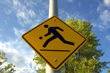 kids playing street sign