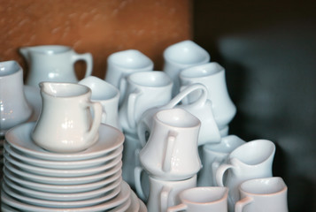 coffee creamers and saucers