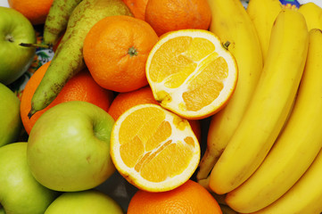 apples, orange and bananas at the market stand