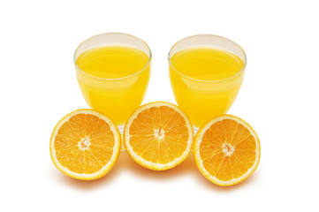 half-cut oranges and fresh orange juice