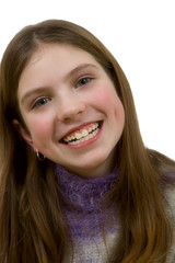 portrait of the young smiling girl on a white background