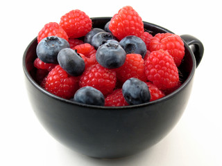 fresh berries in black cup